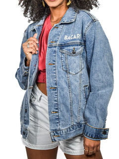 Front view of Bacardi light-wash denim jacket worn by female model over red top and shorts